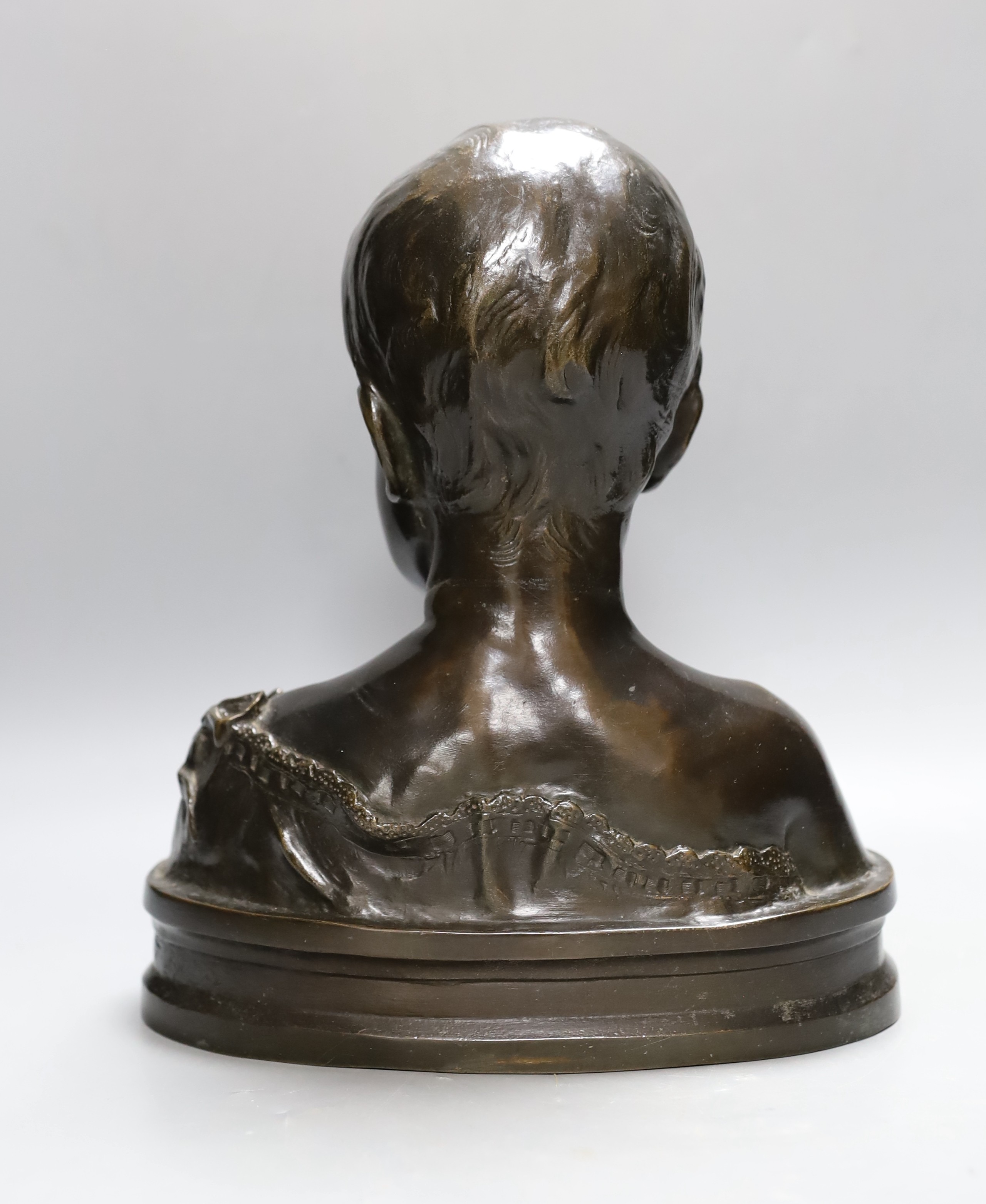 A bronze bust of a boy entitled ‘Leed’, 31cm high